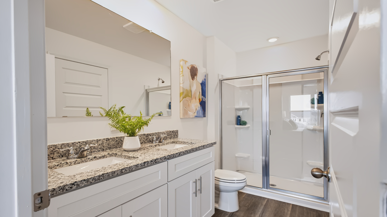 Primary bath upstairs with shower with glass door
