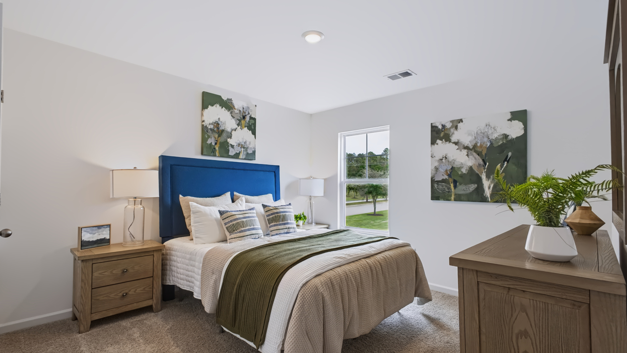 Guest bedroom upstairs with carpeting
