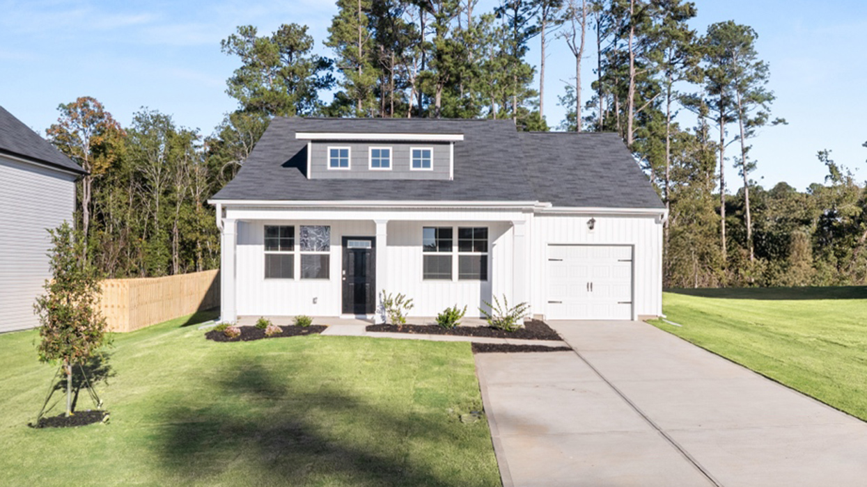 Single story ranch home in white with 1-car garage