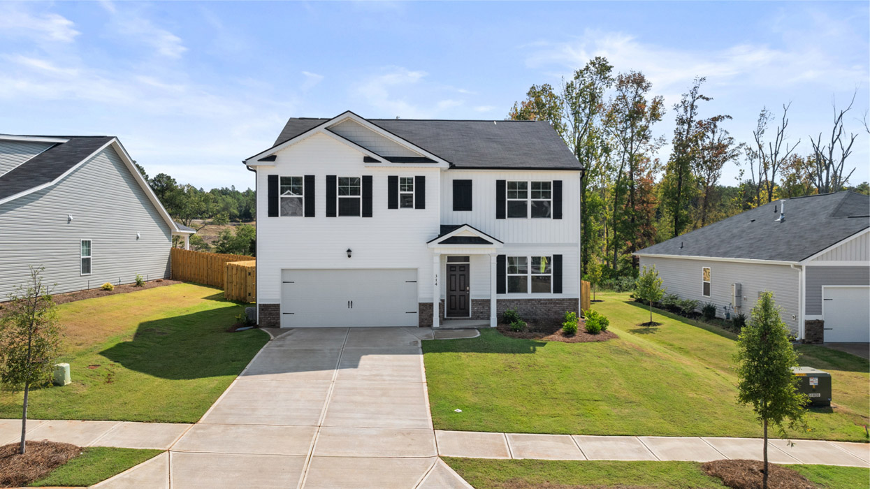 Two story white home with two car garage