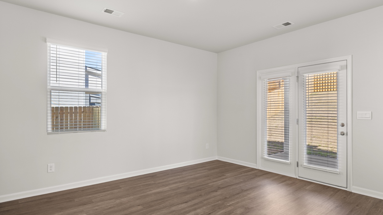 Eat-in-kitchen dining area with door to backyard.