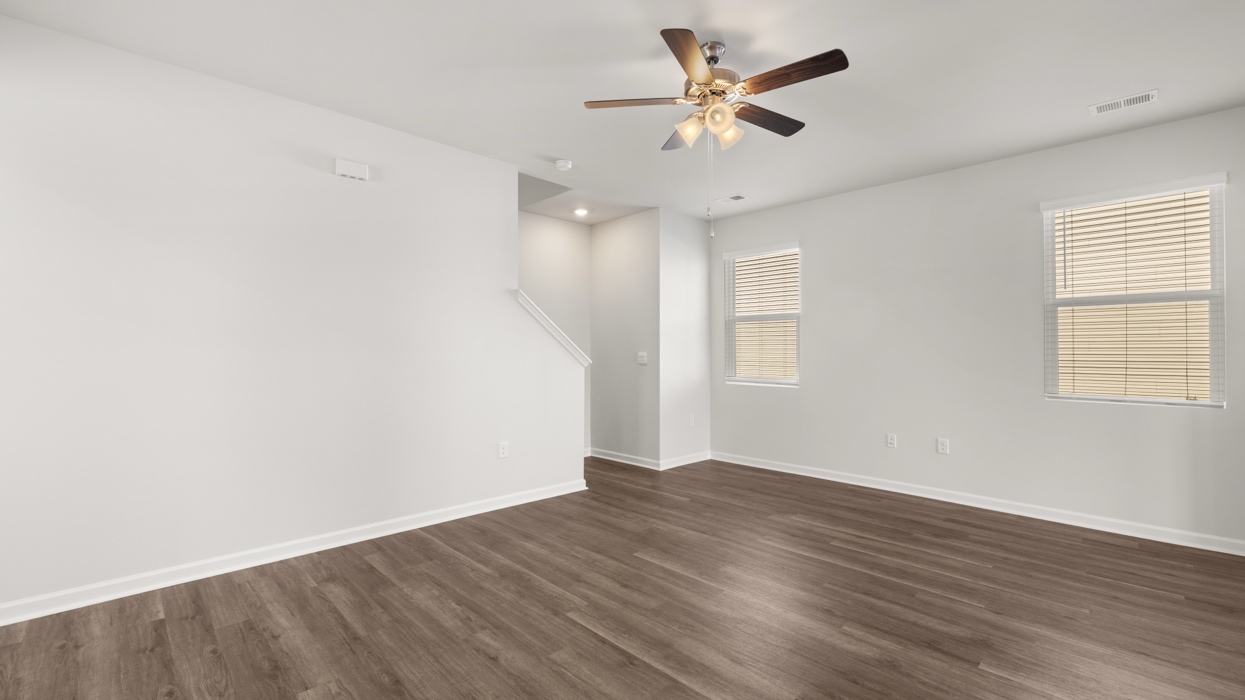 Open plan with living, dining, and kitchen in the heart of the home.