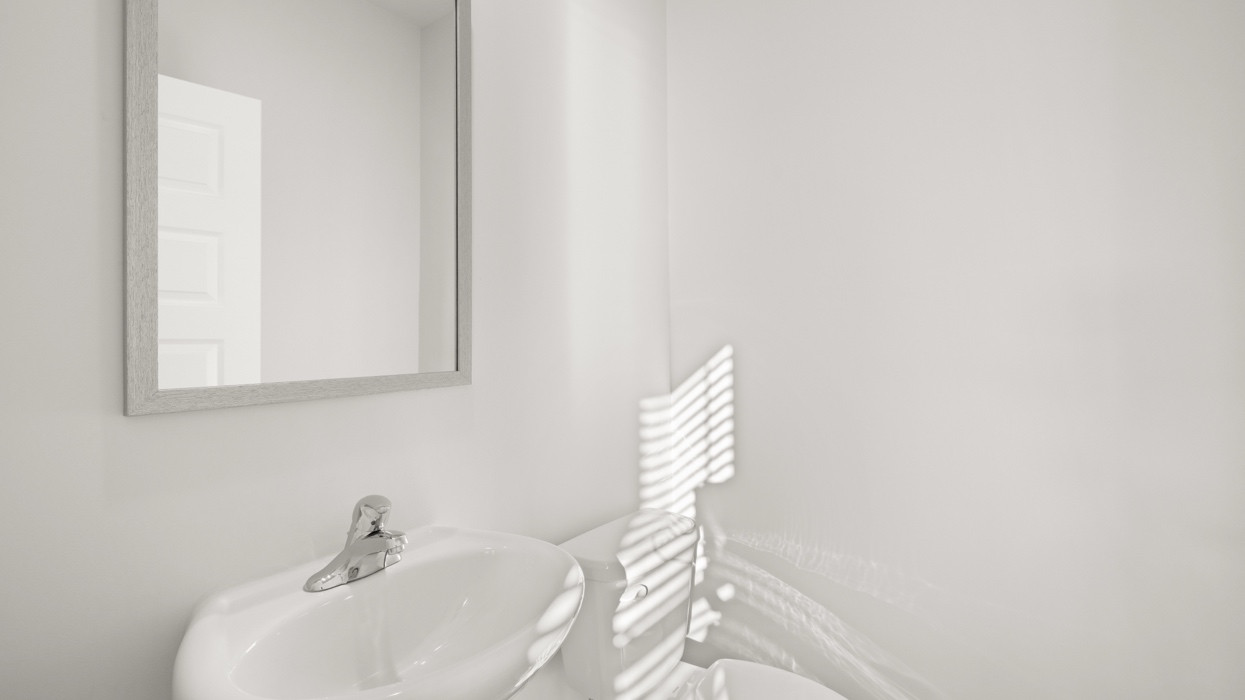 Half bath with pedestal sink and commode