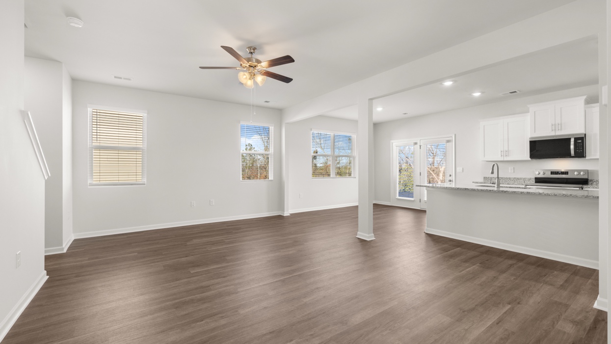 Open plan with living, dining, and kitchen in the heart of the home.