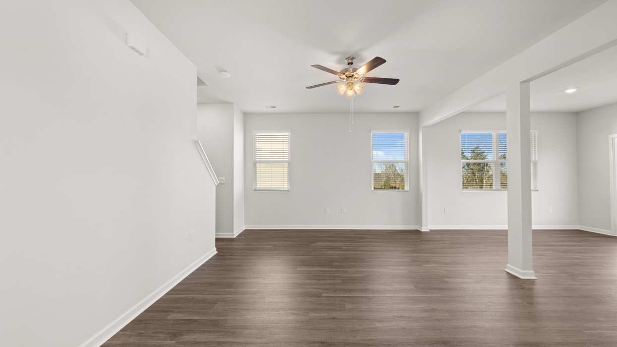 Open plan featuring large living and dining area opening to kitchen with large center island.