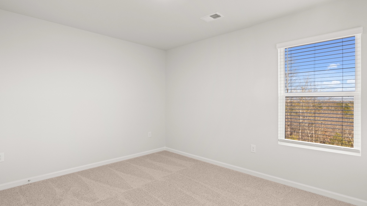 Guest bedroom with carpeting