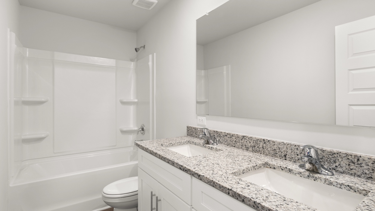 Guest bath with double vanity and combo shower/tub