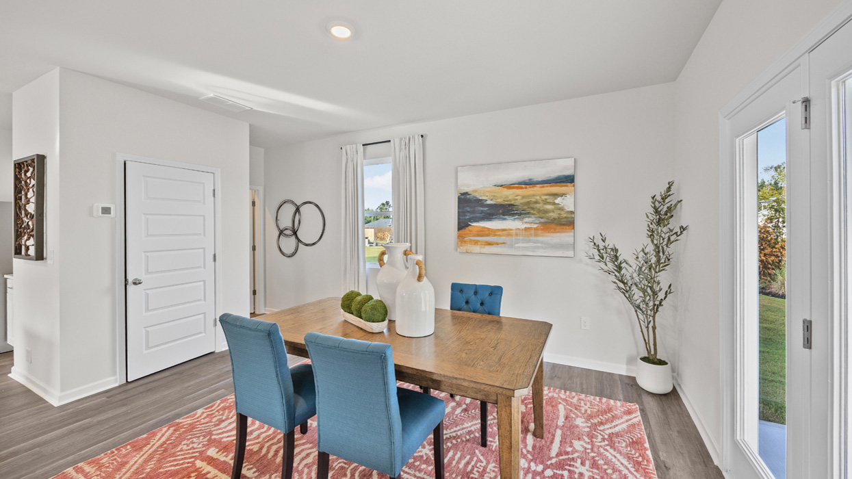 Dining area with closet and back door on the right