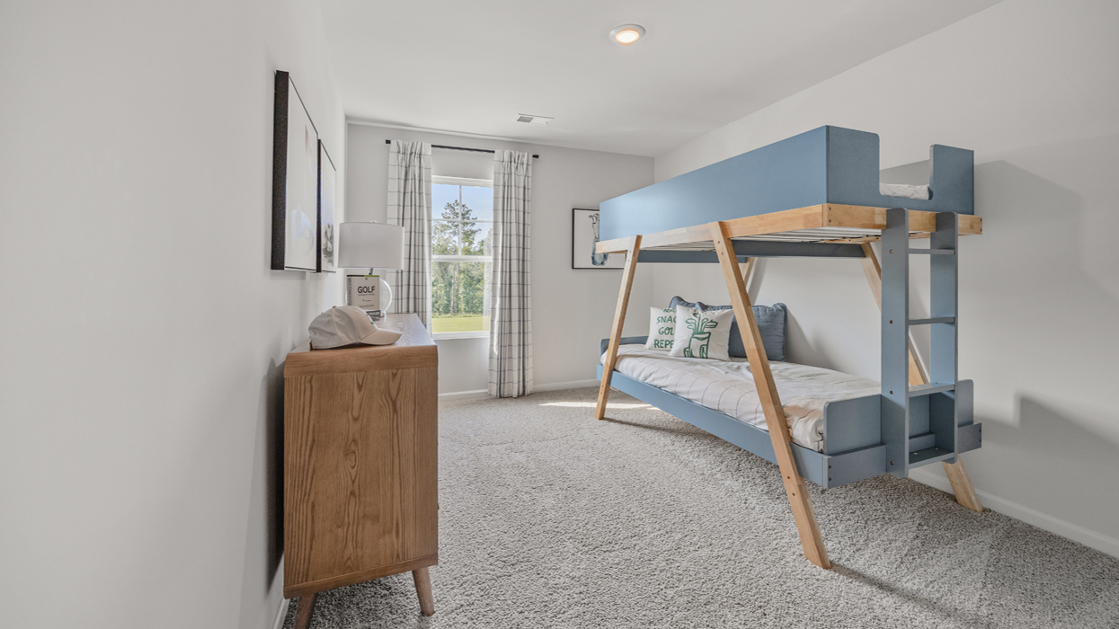 Guest bedroom upstairs with carpeting