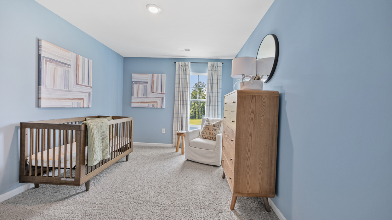 Guest bedroom upstairs with carpeting