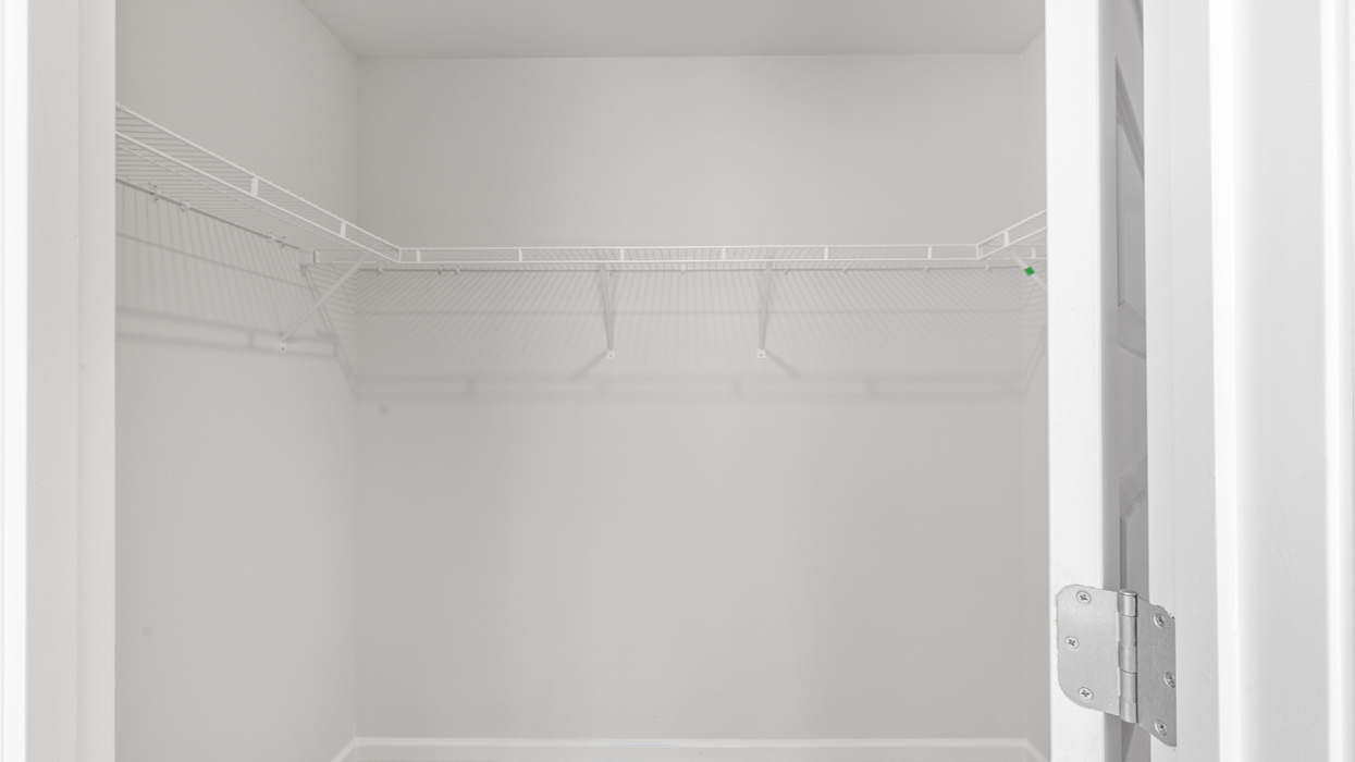 Primary bedroom closet with shelving