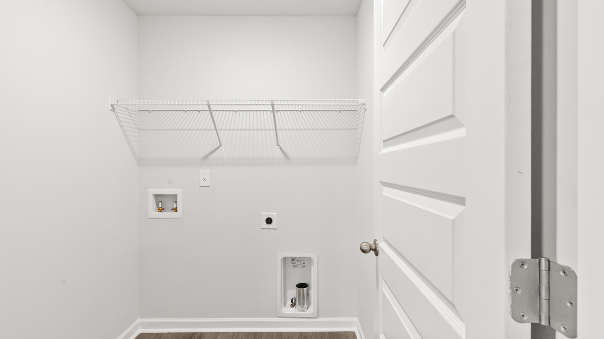 Laundry room upstairs with shelving