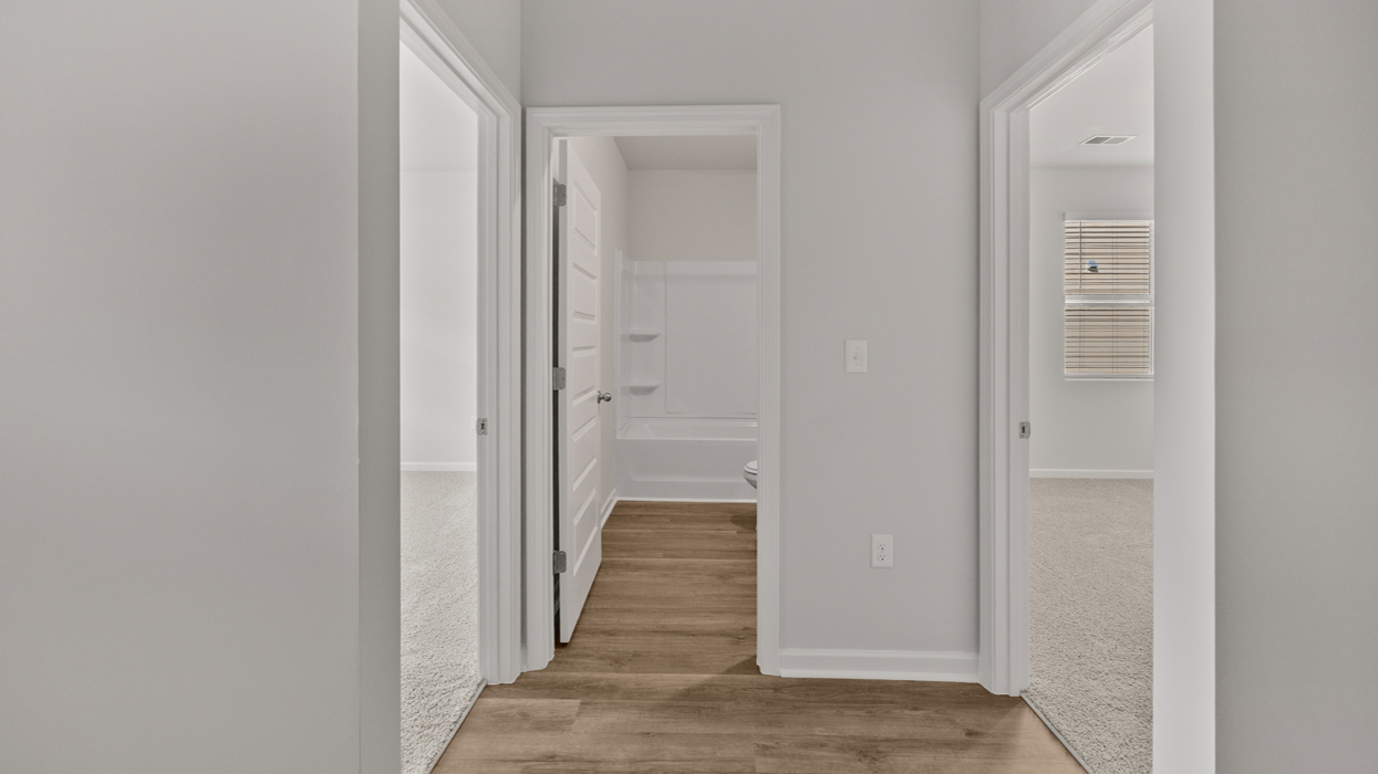 Front hallway leading to 3 guest bedrooms and guest bath