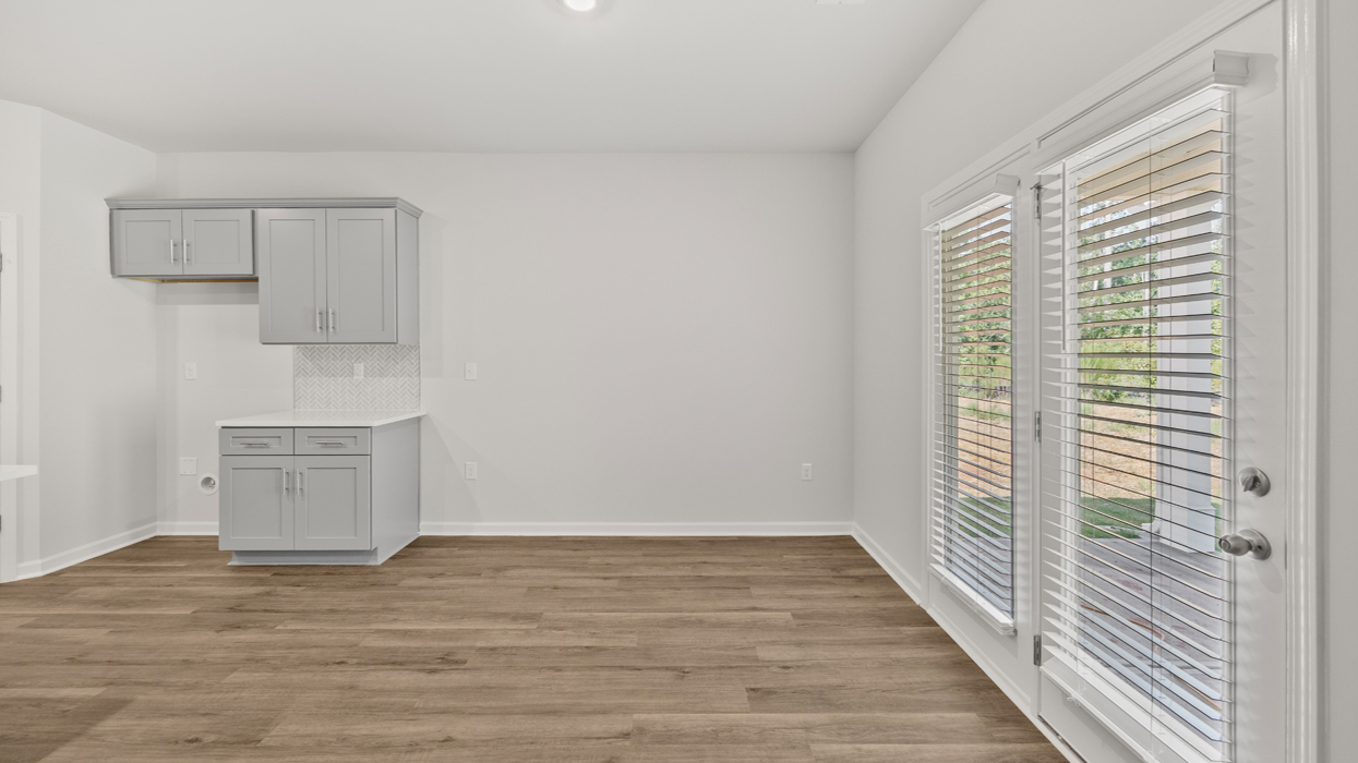 Eat-in-kitchen off of living room with back door to yard.