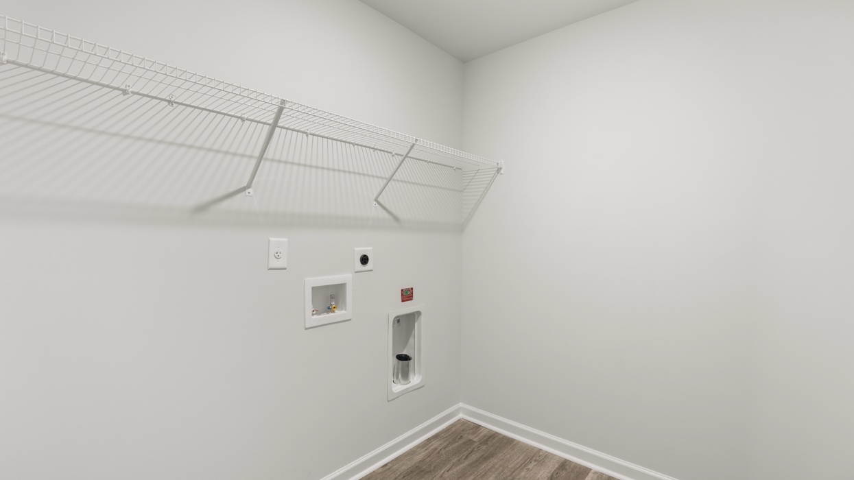 Upstairs laundry room with shelving