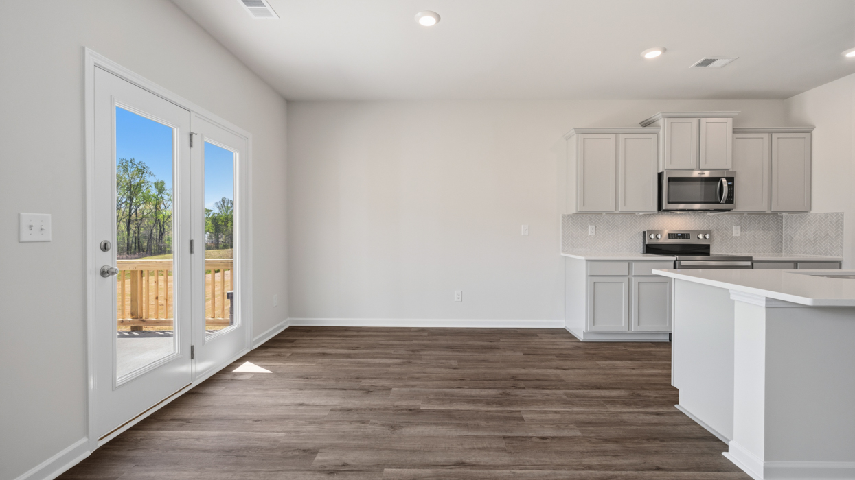 Eat-in-kitchen with door to the backyard