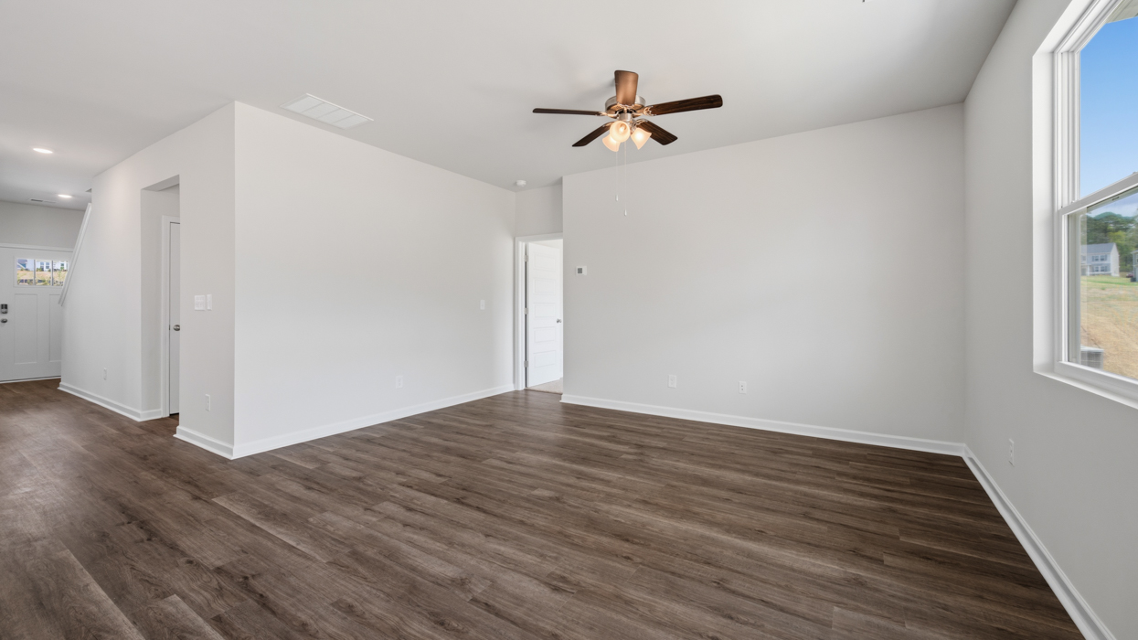 Living room located off of kitchen and dining area