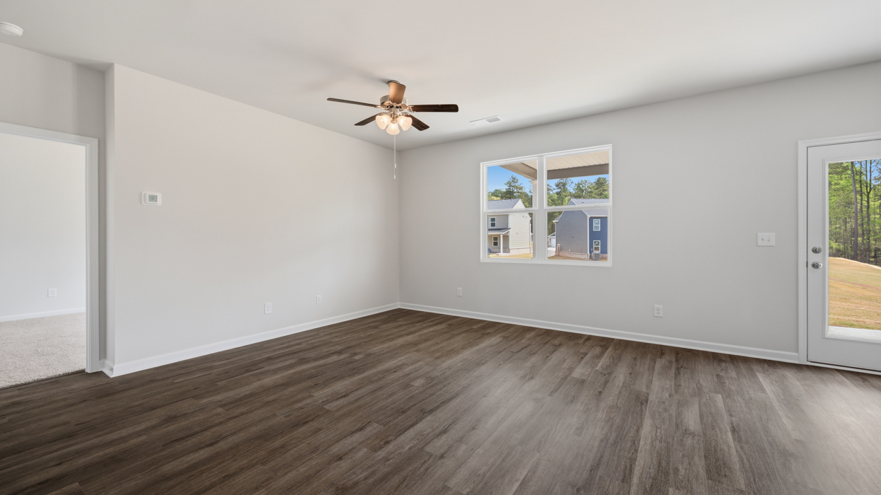 Living room located off of kitchen and dining area