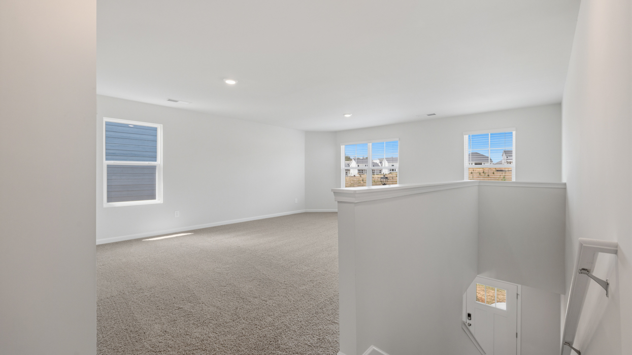 Huge loft located at top of staircase landing.