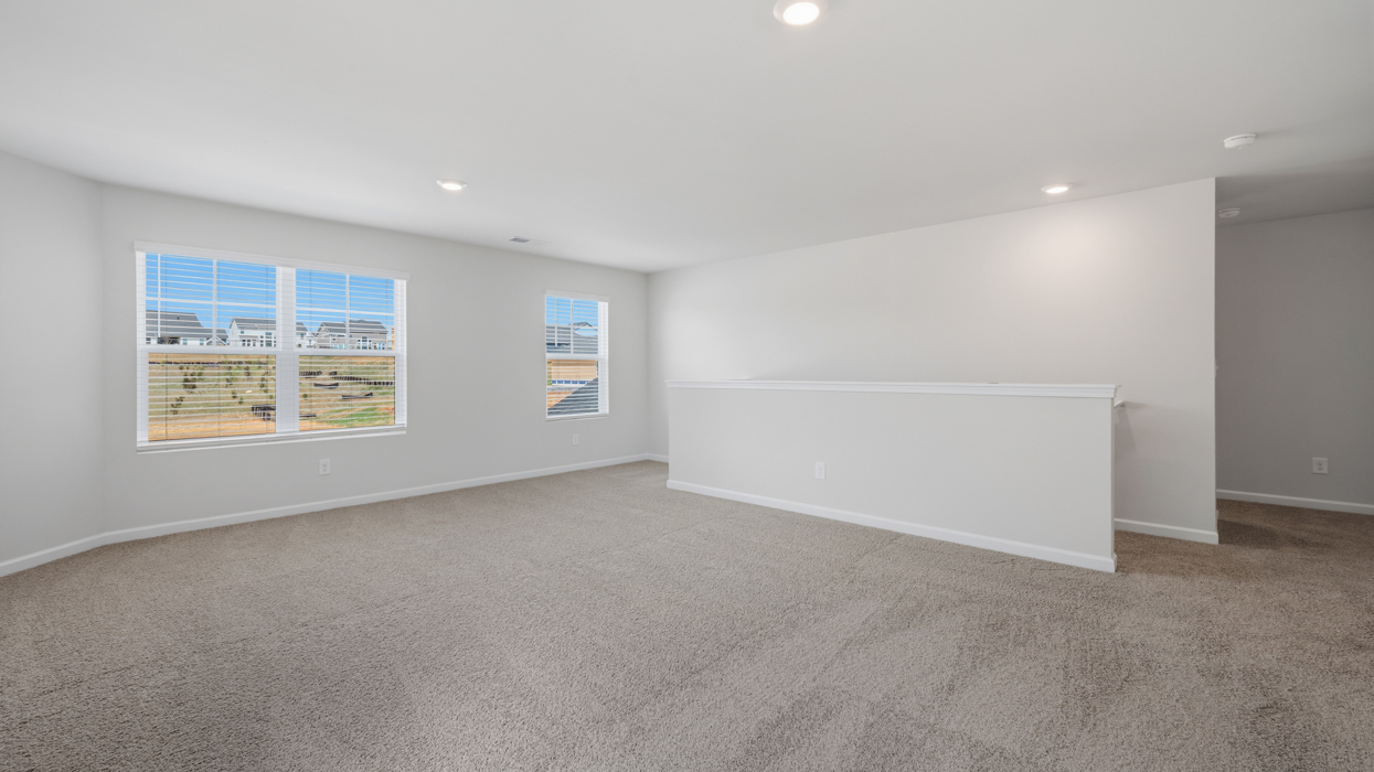 Huge loft located at top of staircase landing.