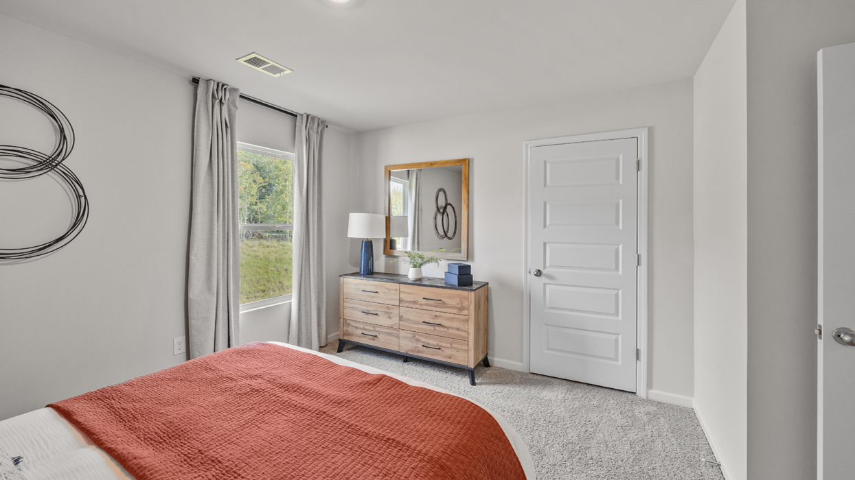 Guest bedroom upstairs with carpeting