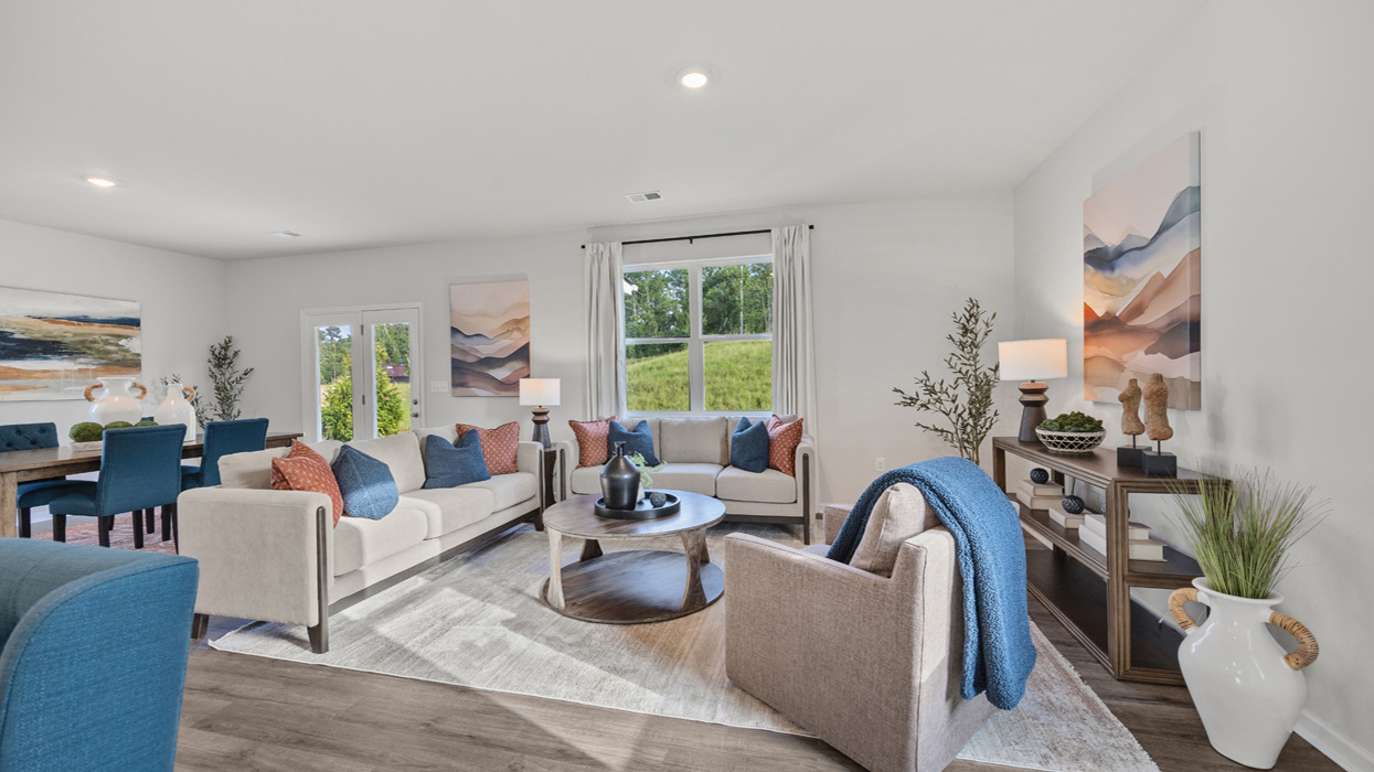 Open floorplan with living room, dining, and kitchen on main floor.