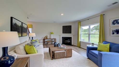 Living room with large window, and fireplace