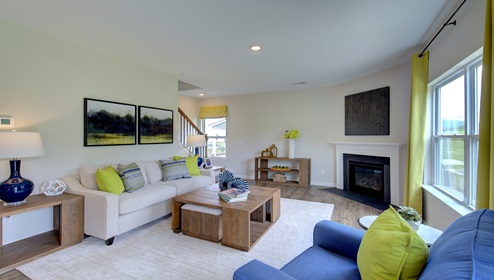 Living room with large window, and fireplace