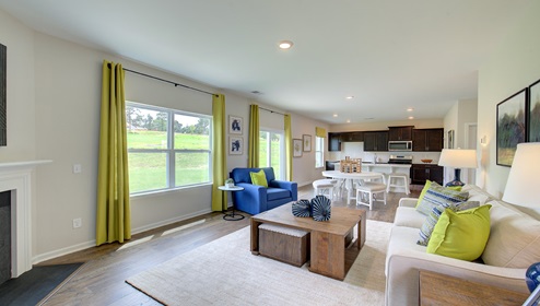 Living room with large window, and fireplace