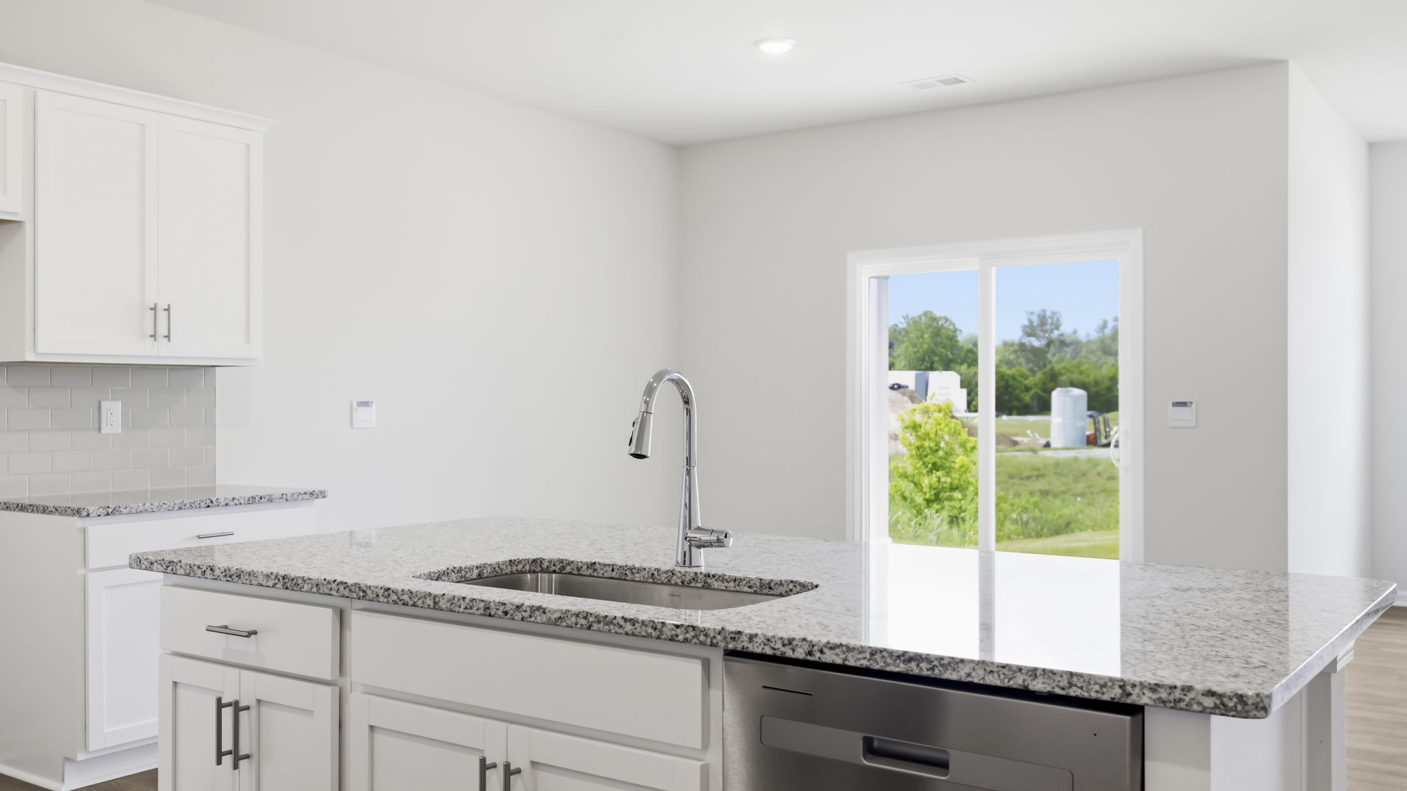 Open concept kitchen with large island and stainless steel appliances
