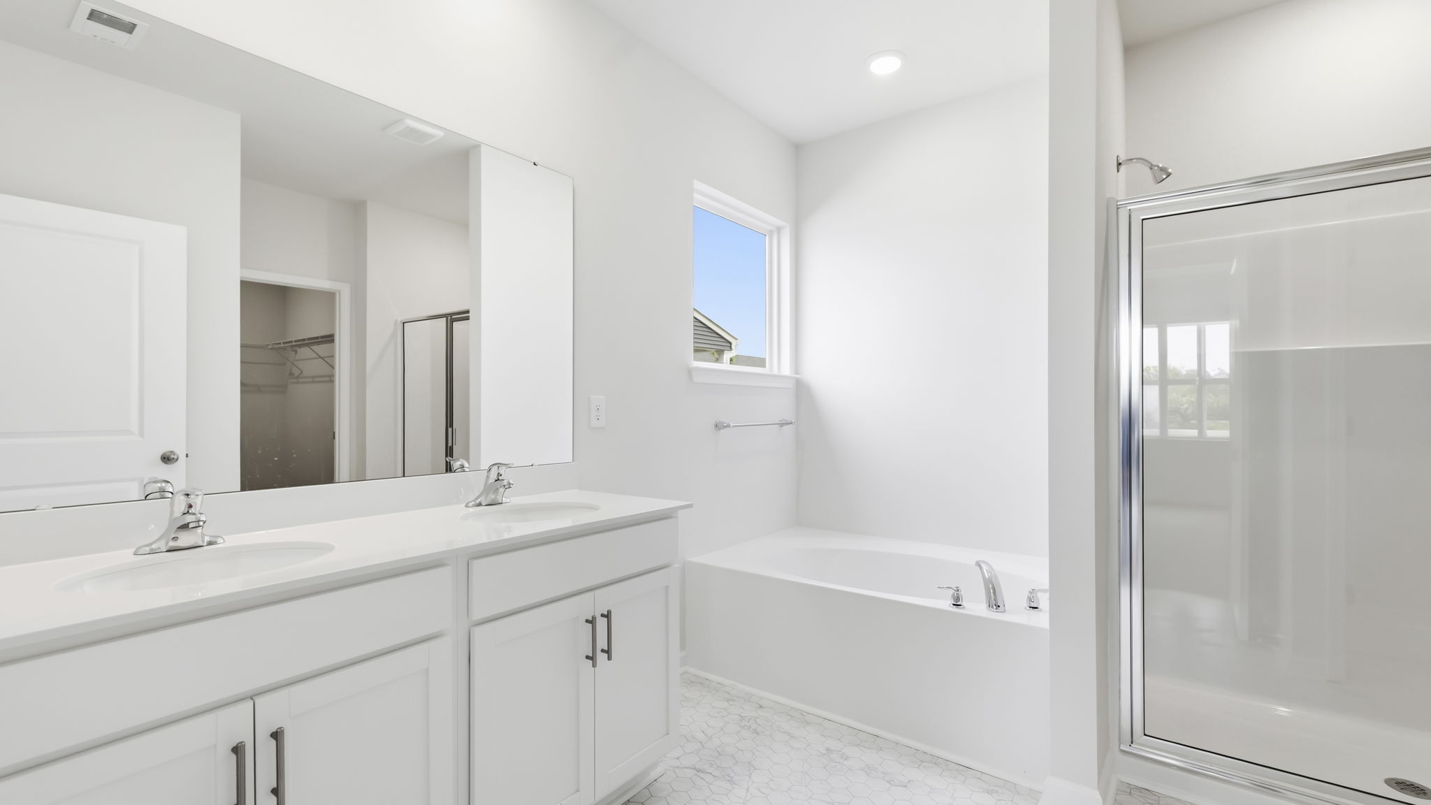 Primary bathroom with garden tub and walk in shower