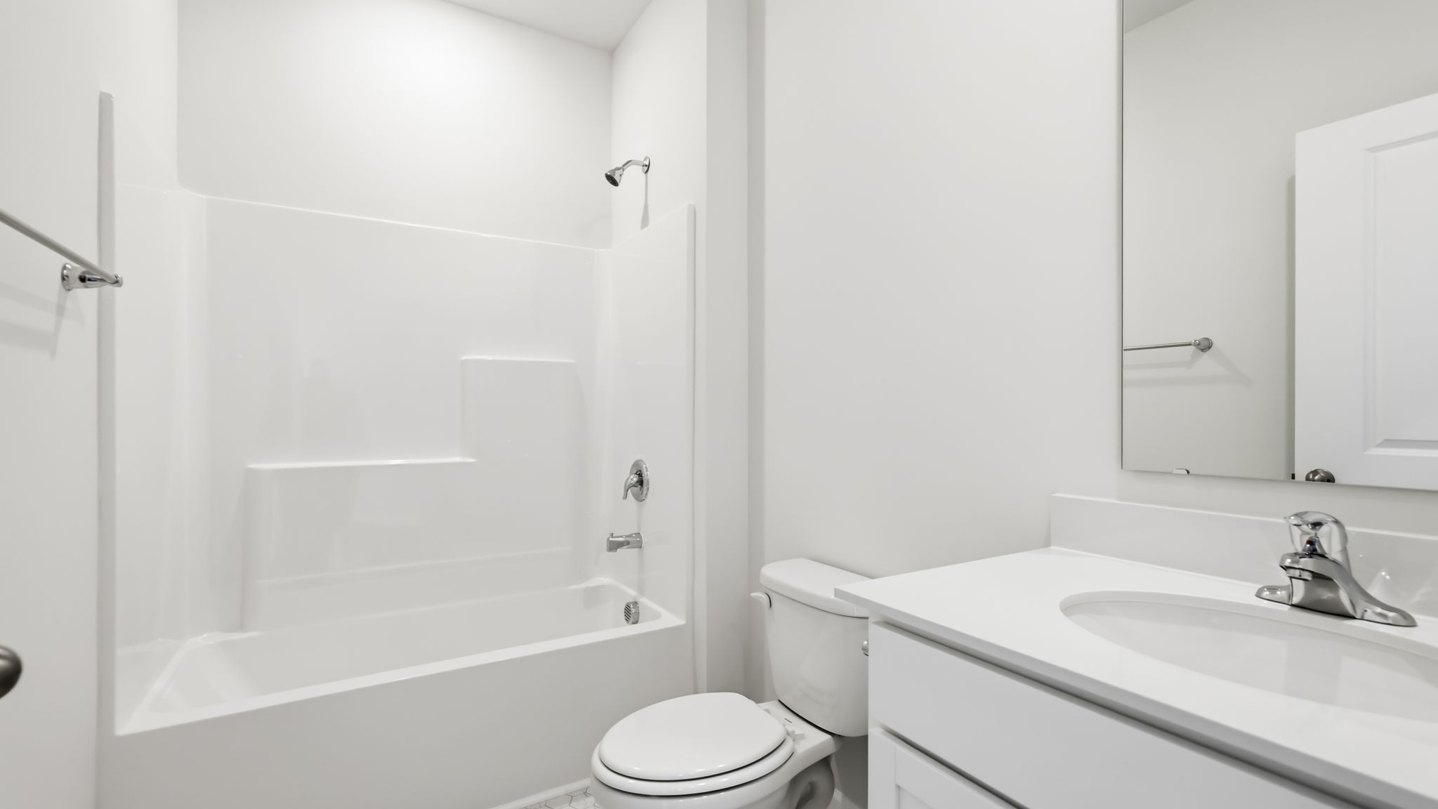 Bathroom with dual vanity and bathtub