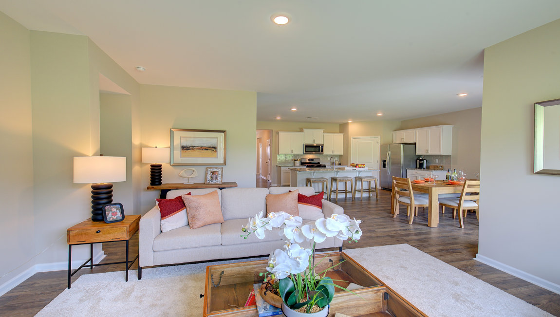 Open living room area with large windows and gas fireplace