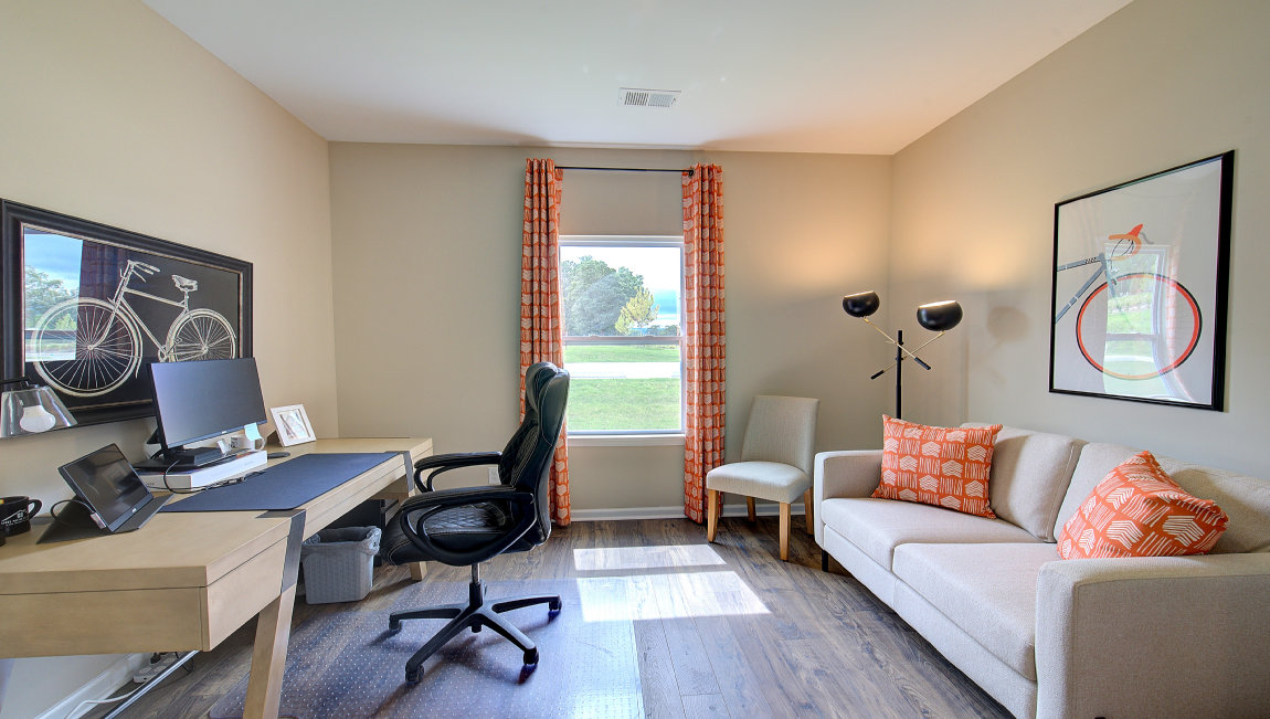 Carpeted bedroom with large window