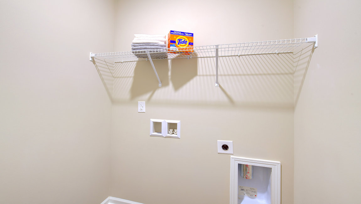 Laundry room with shelving