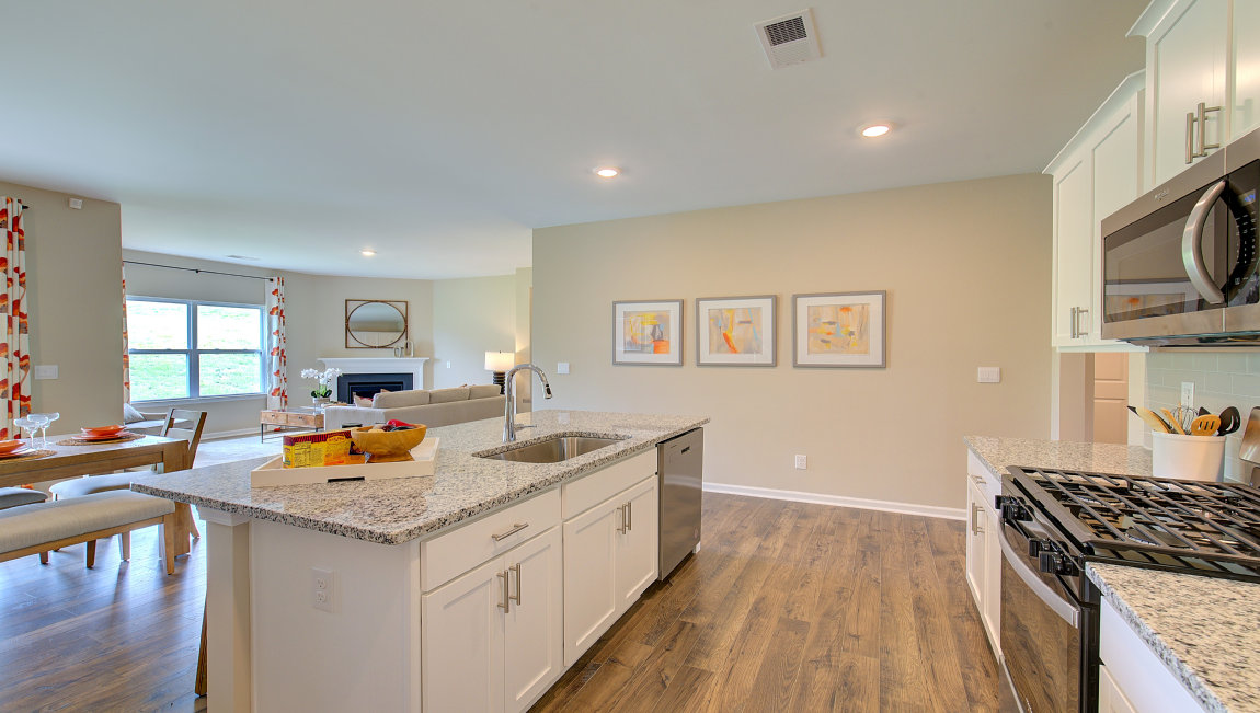 Open concept kitchen with large island and stainless steel appliances
