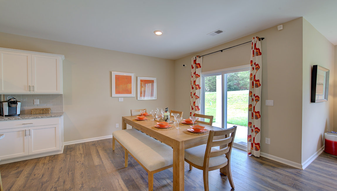 Open dining area with sliding glass doors to back patio