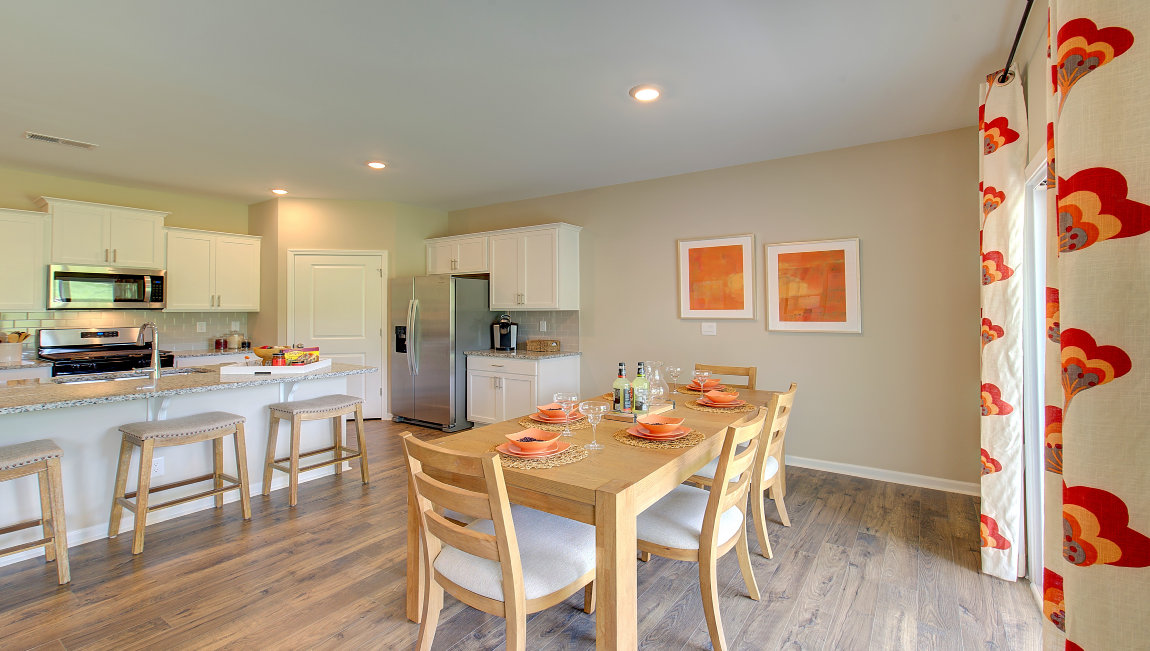 Open dining area with sliding glass doors to back patio