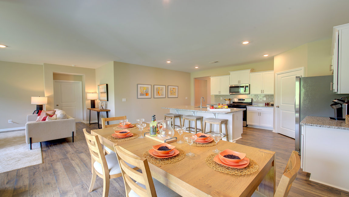 Open dining area with sliding glass doors to back patio