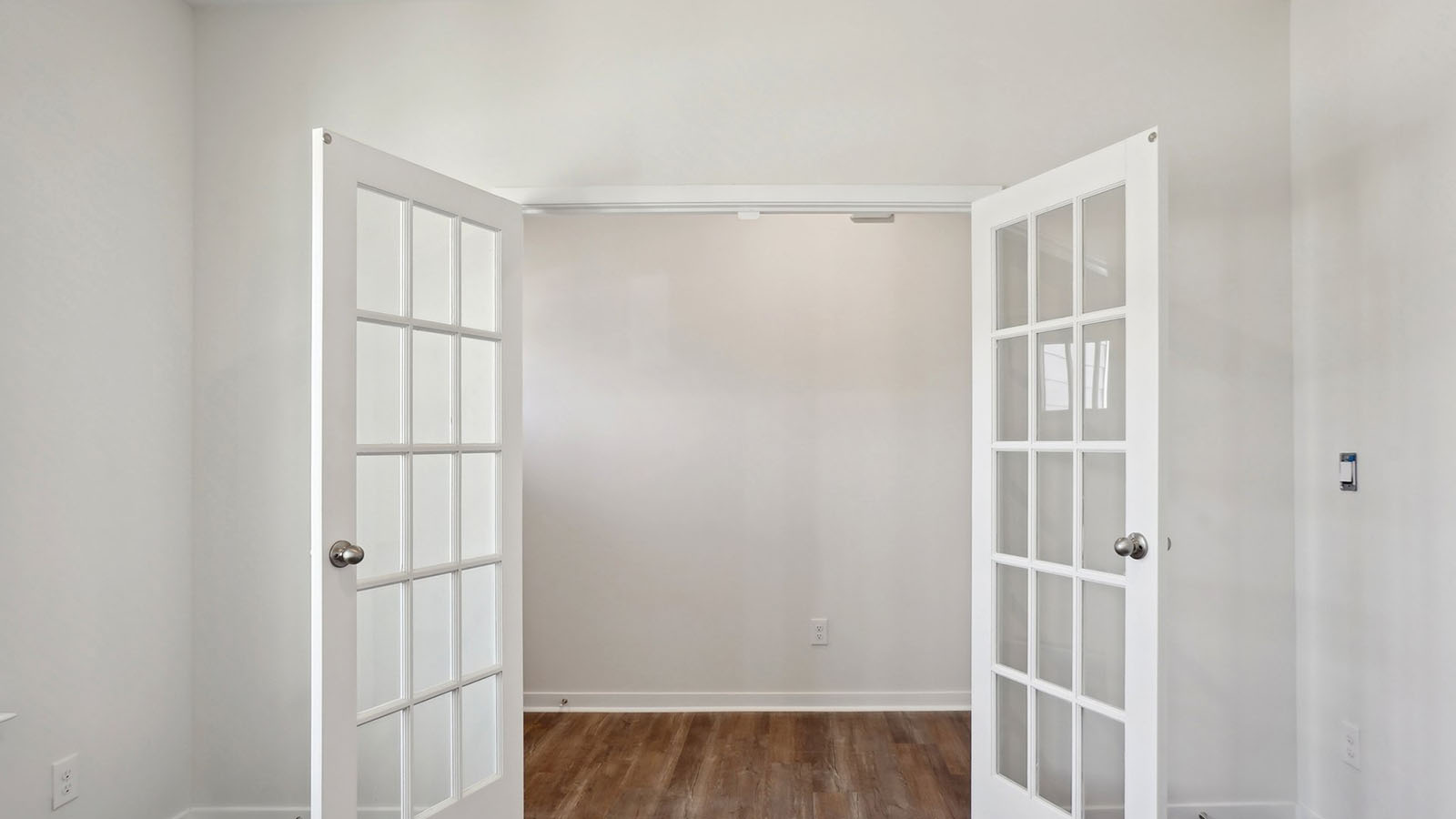 Bright office space with glass doors and big windows