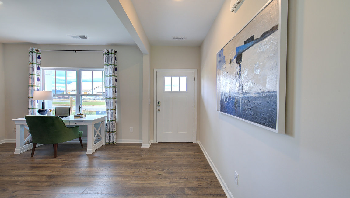 Welcoming foyer with large windows