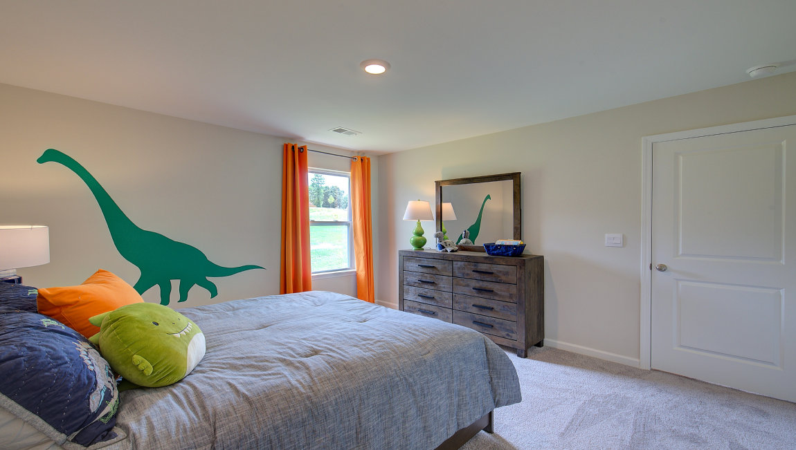 Carpeted bedroom with large window