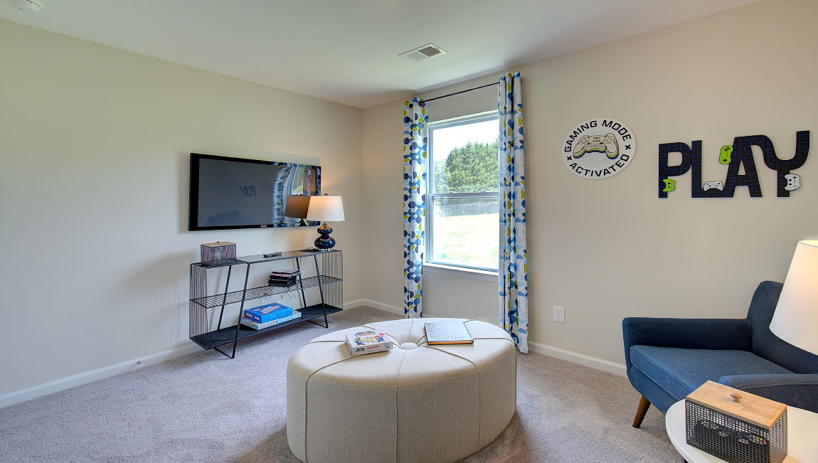 Carpeted bedroom with large window