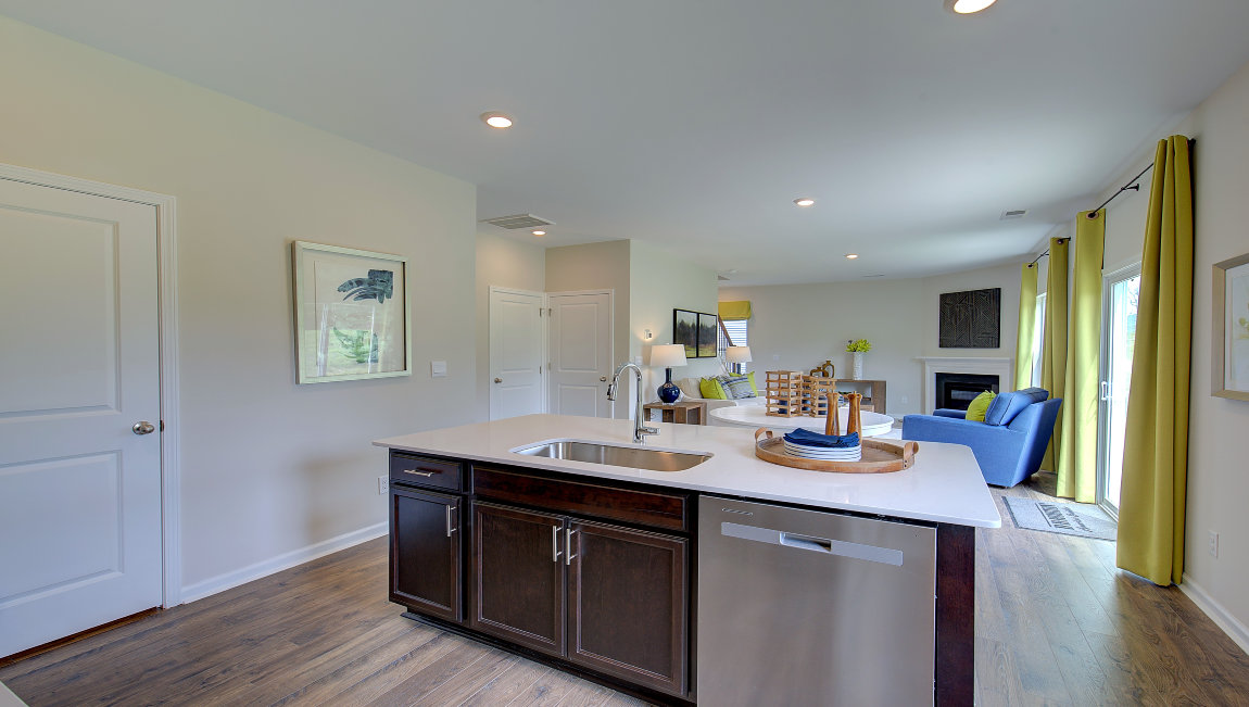 Open concept kitchen with large island and stainless steel appliances