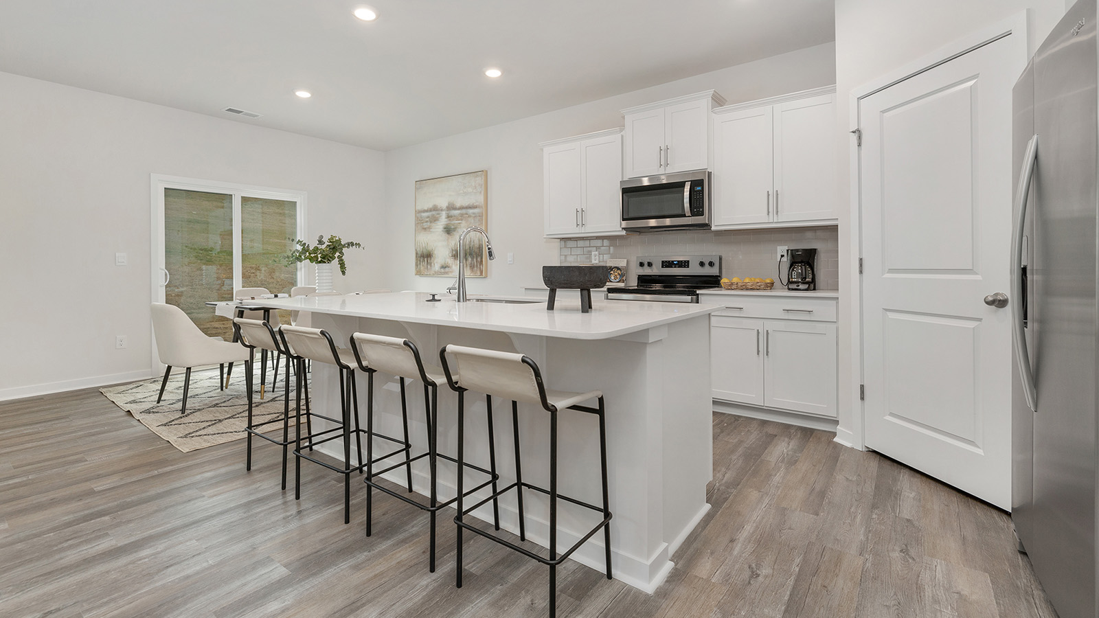 Open kitchen with island and stainless steel appliances