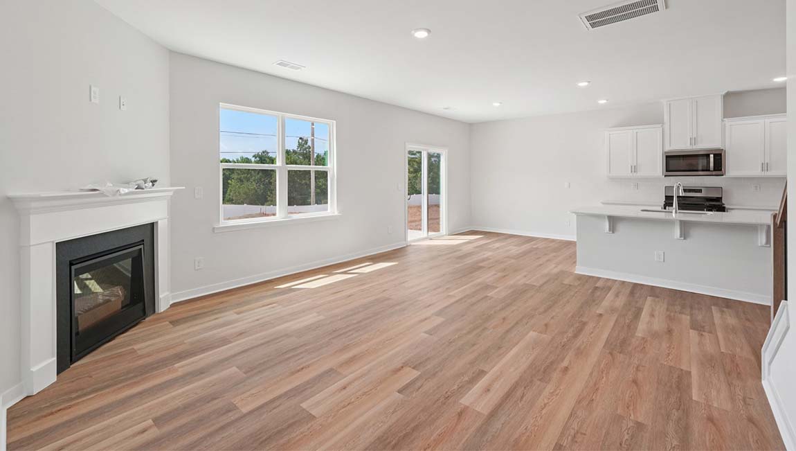 Open living area with large windows and gas fireplace