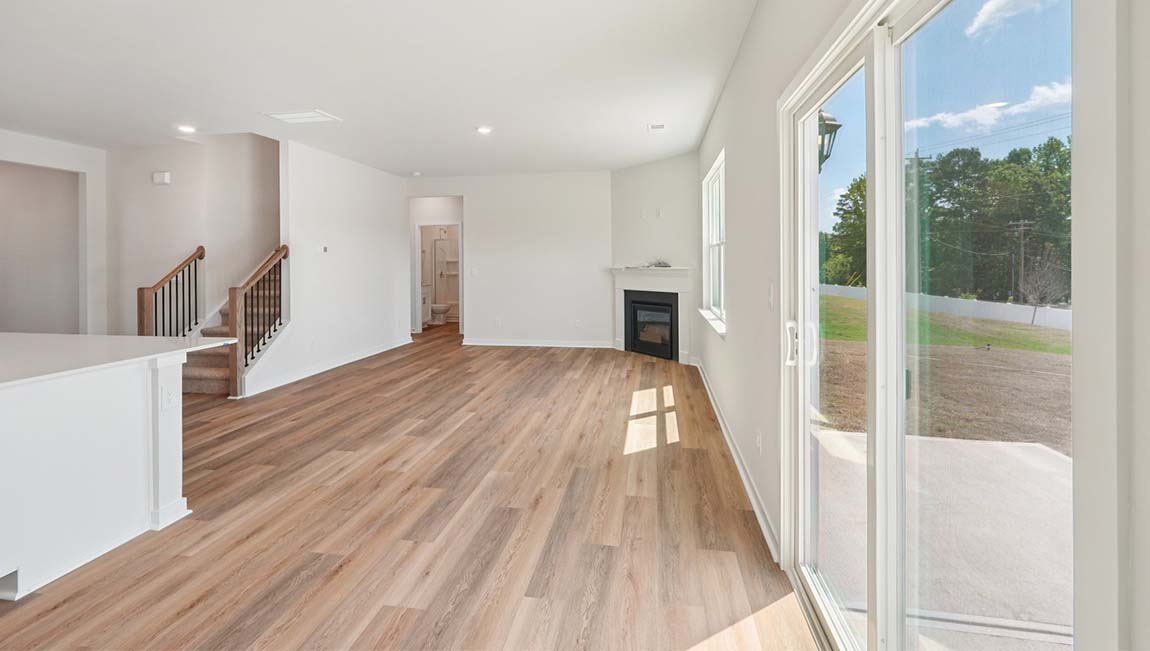 Open living area with large windows and gas fireplace