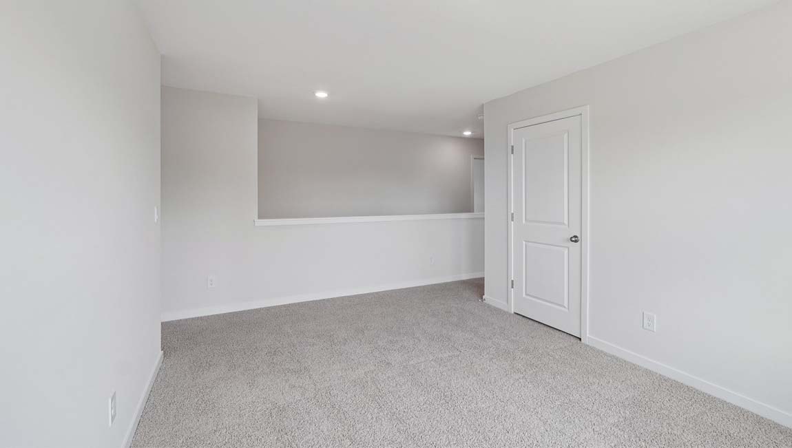 Carpeted loft area upstairs