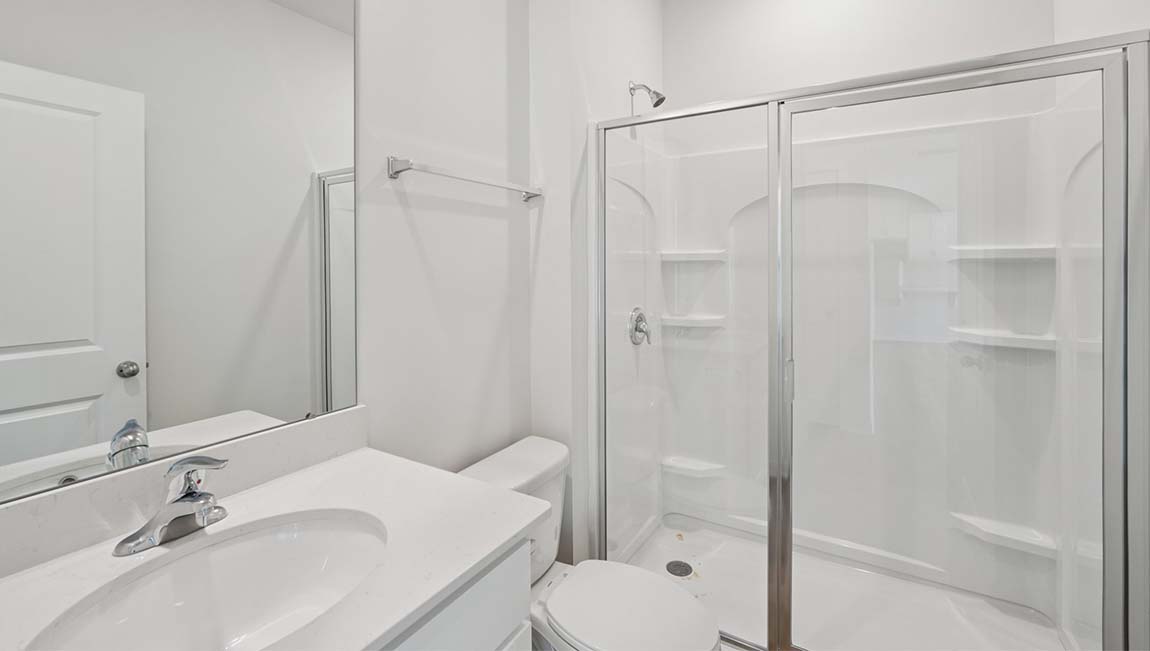 Bathroom with single vanity and walk in shower
