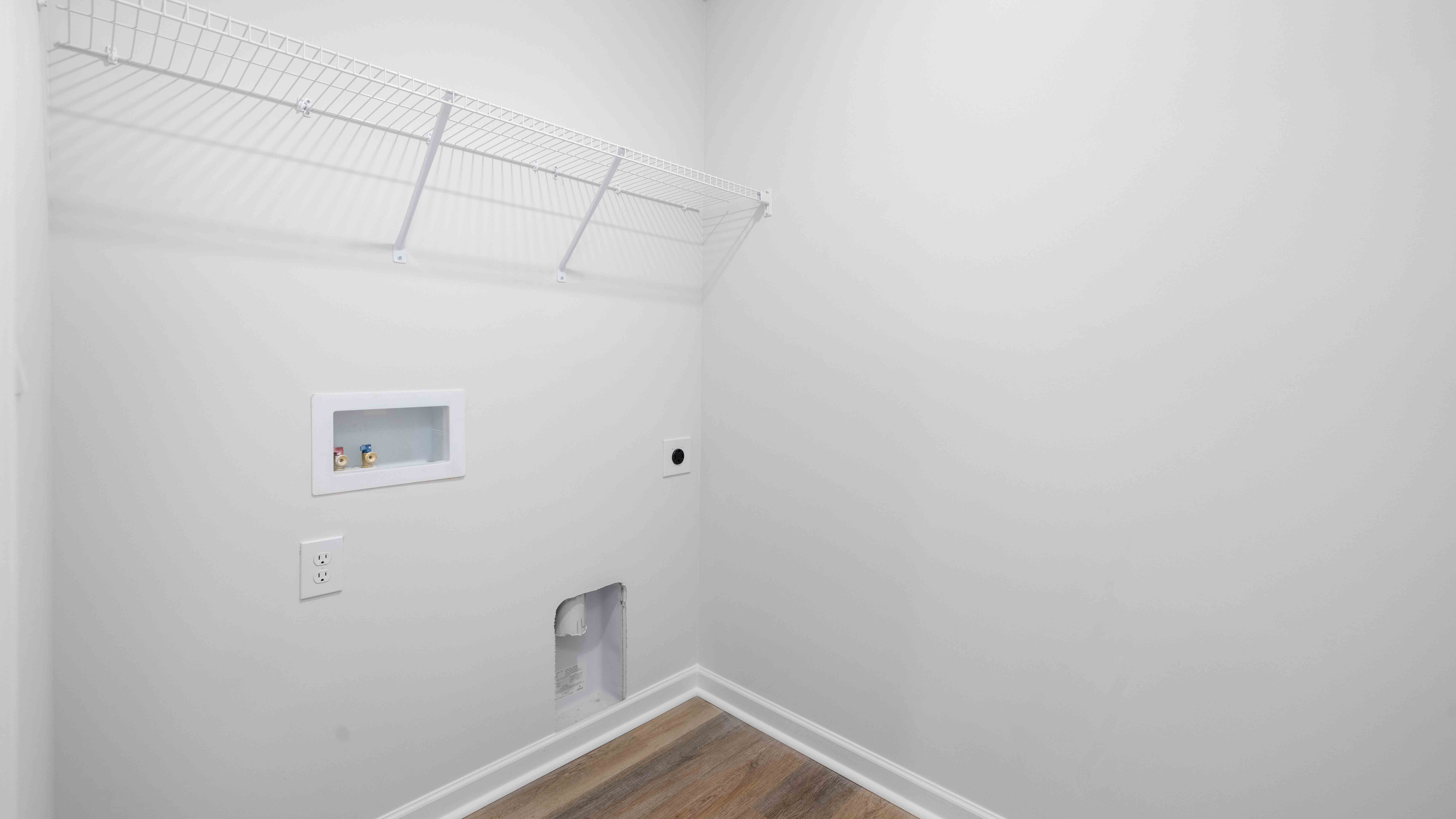 Laundry room with shelving
